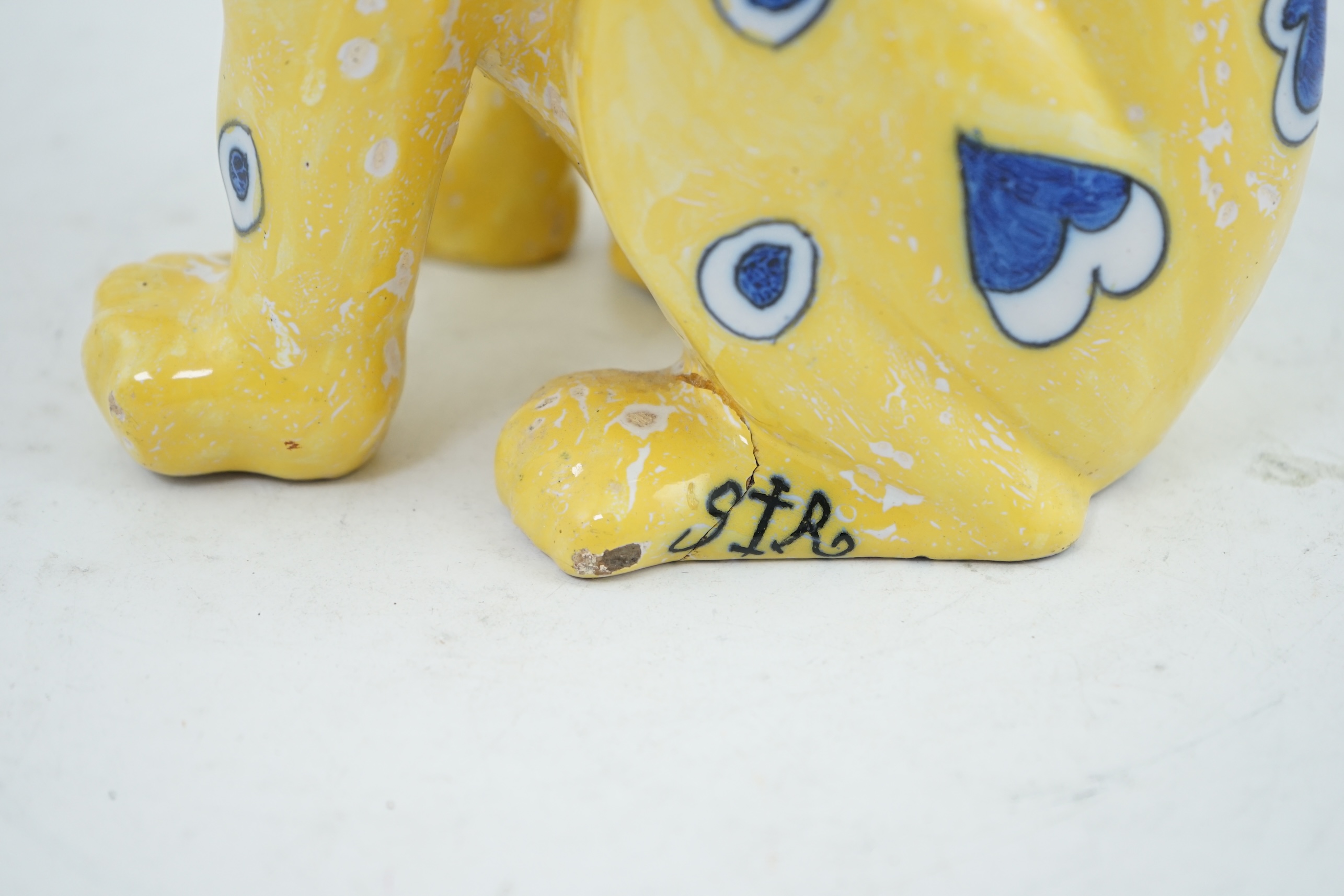 A Gallé yellow faience model of a seated smiling cat, c.1885